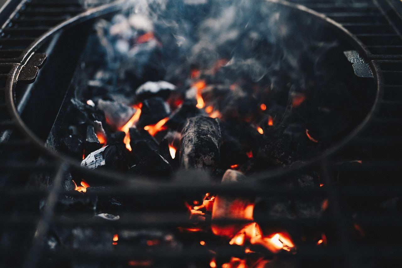Close-up of glowing charcoal embers, perfect for exploring if grilling is for you. Let's find out!