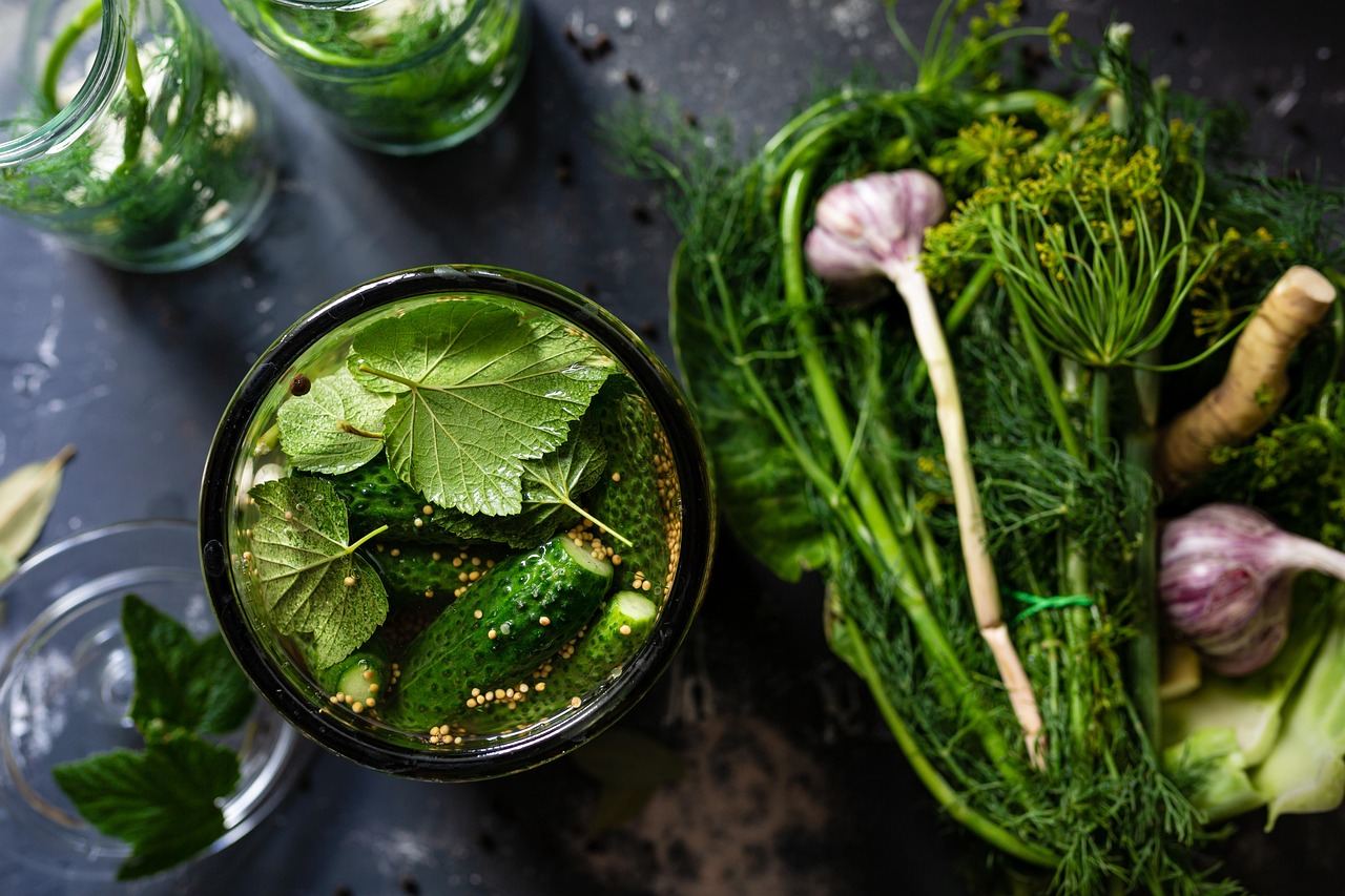 Fresh cucumbers and herbs in a jar, perfect for exploring fermentation. Is Fermenting for you? Let's find out!