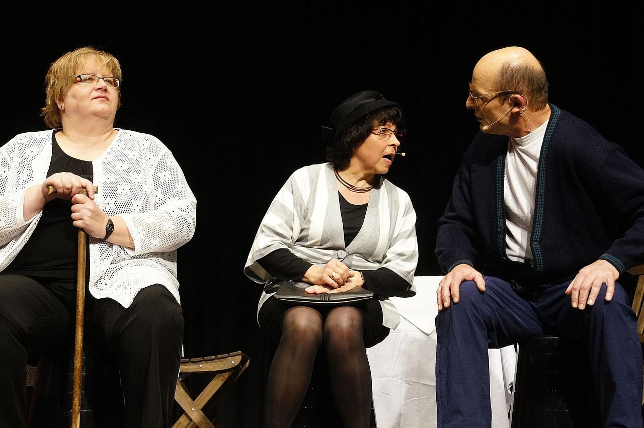 Three actors engaged in a lively improv scene, showcasing spontaneity for 'Is Improv Acting for you? Let's find out!'