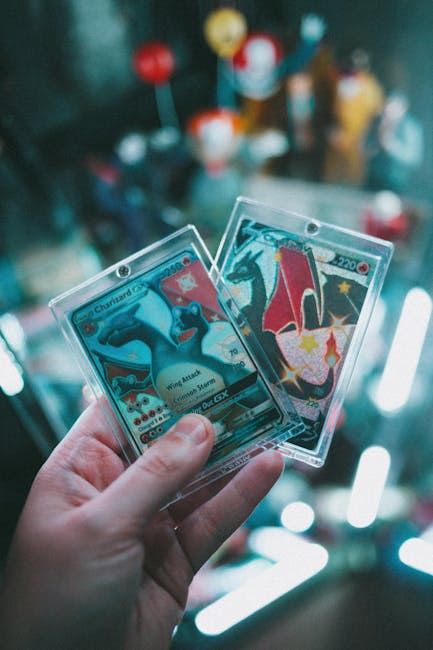 A person holding two trading cards featuring colorful designs, showcasing the appeal of card collecting.