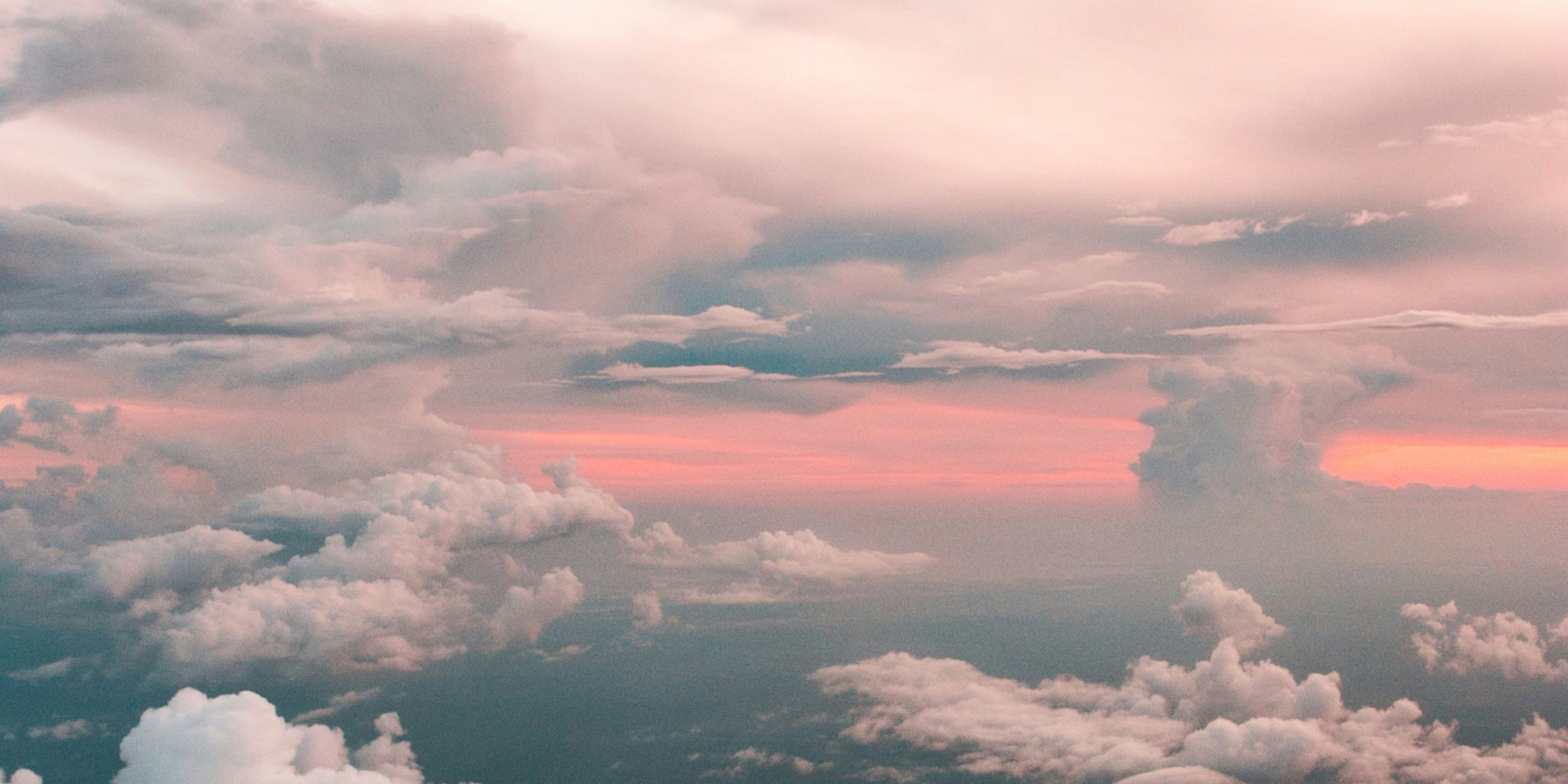 An aerial view of a cloudy sky at sunset