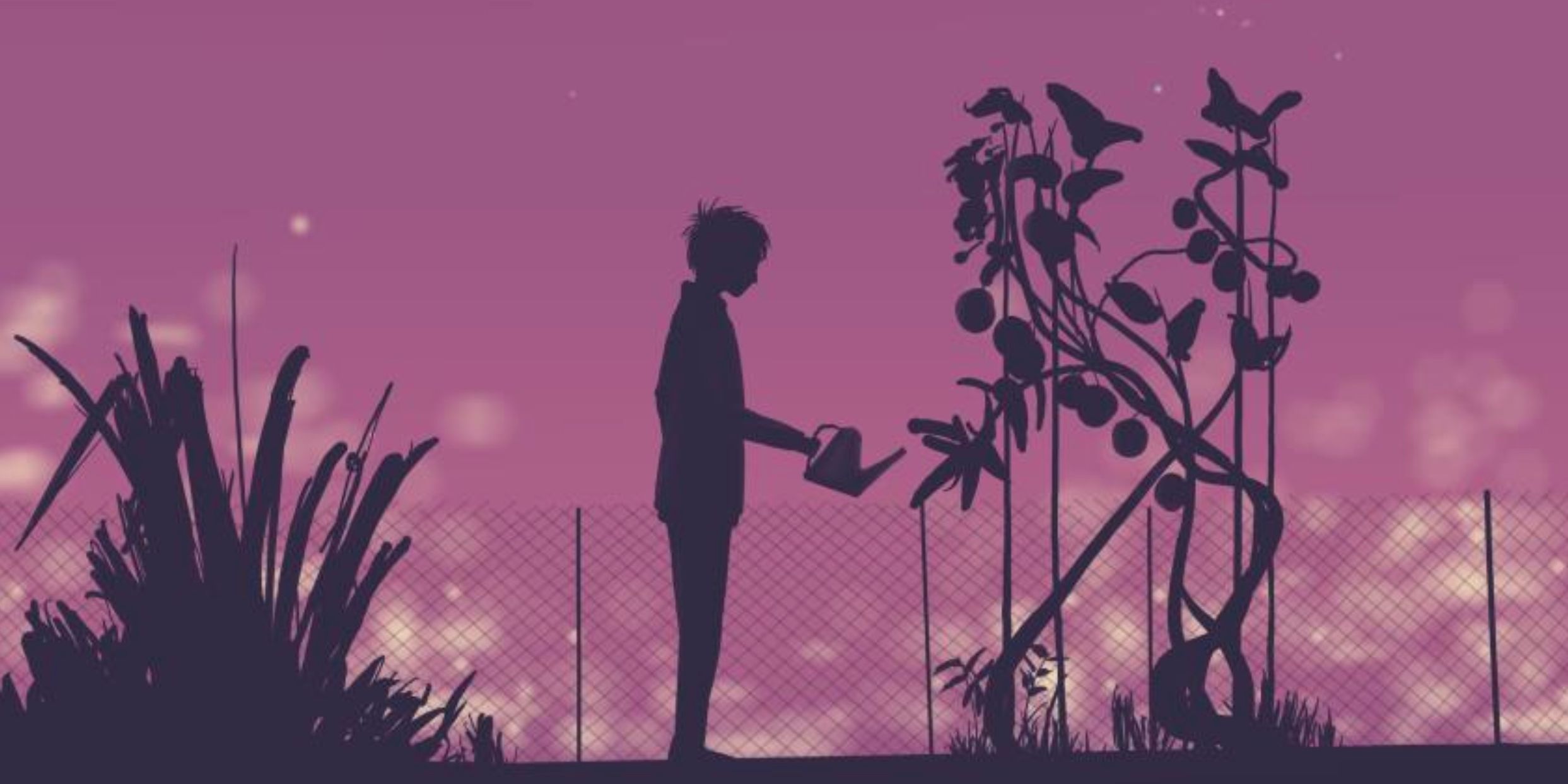 A man is watering a tomato plant in a garden at night