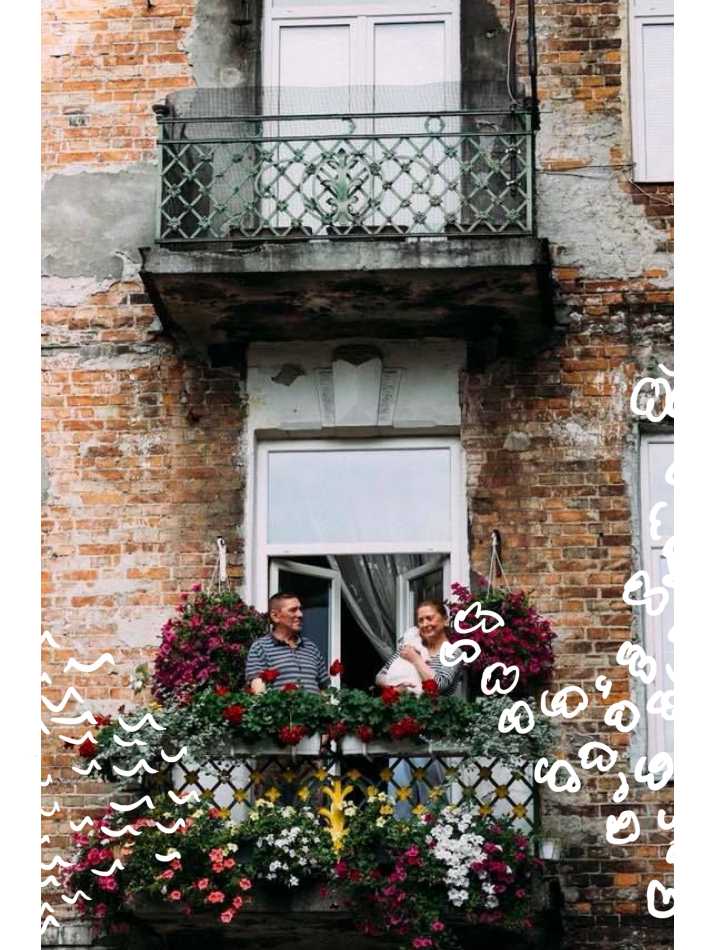 Couple in the balcony during warsaw in flowers