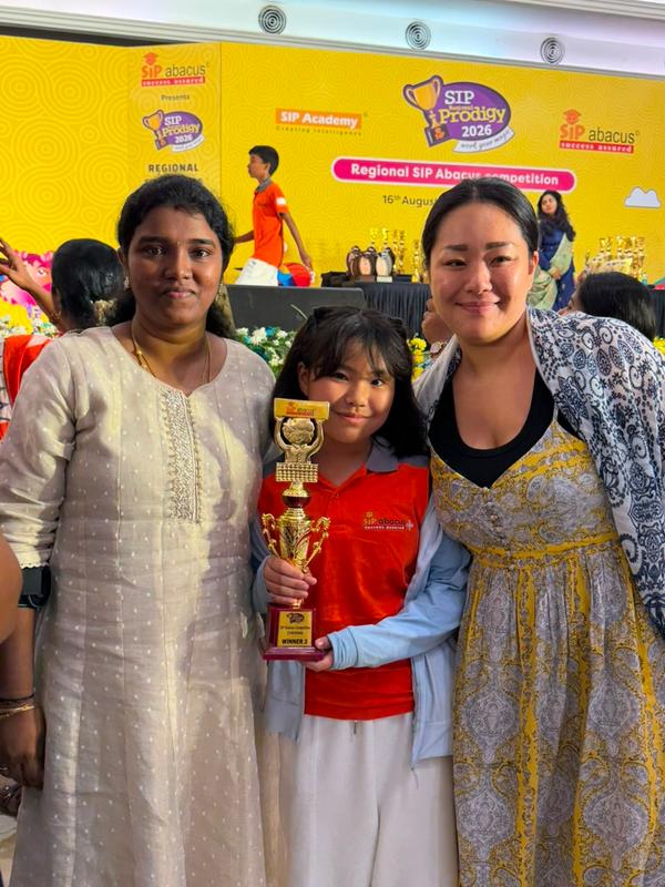 Parents celebrating their child's competition result.