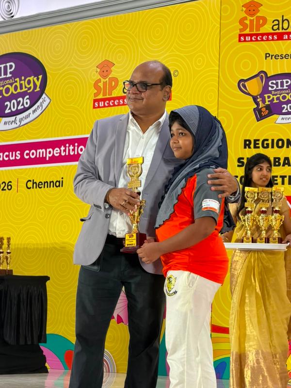 One of our young champions with their award.