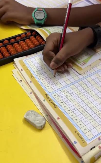 A student practising speed writing exercises
