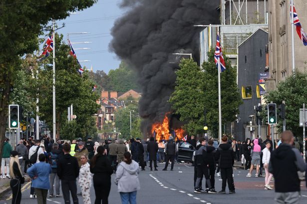 Belfast disorder: Police take two-month-old baby to safety during night of violence Belfast disorder: Police take two-month-old baby to safety during night of violence
