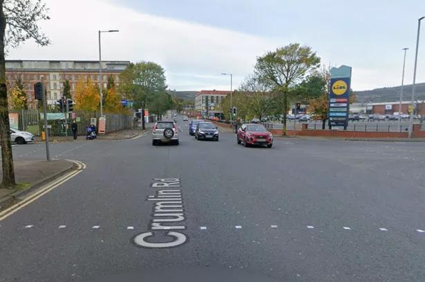 Three Hospitalised Following Crumlin Road Collision; Police Appeal for Info