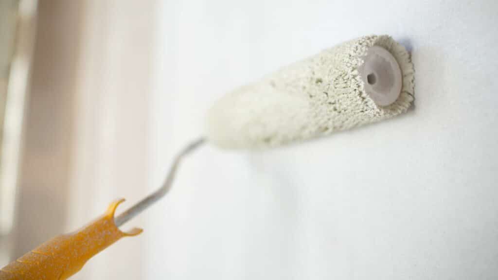 paint-roller-brush-on-wall