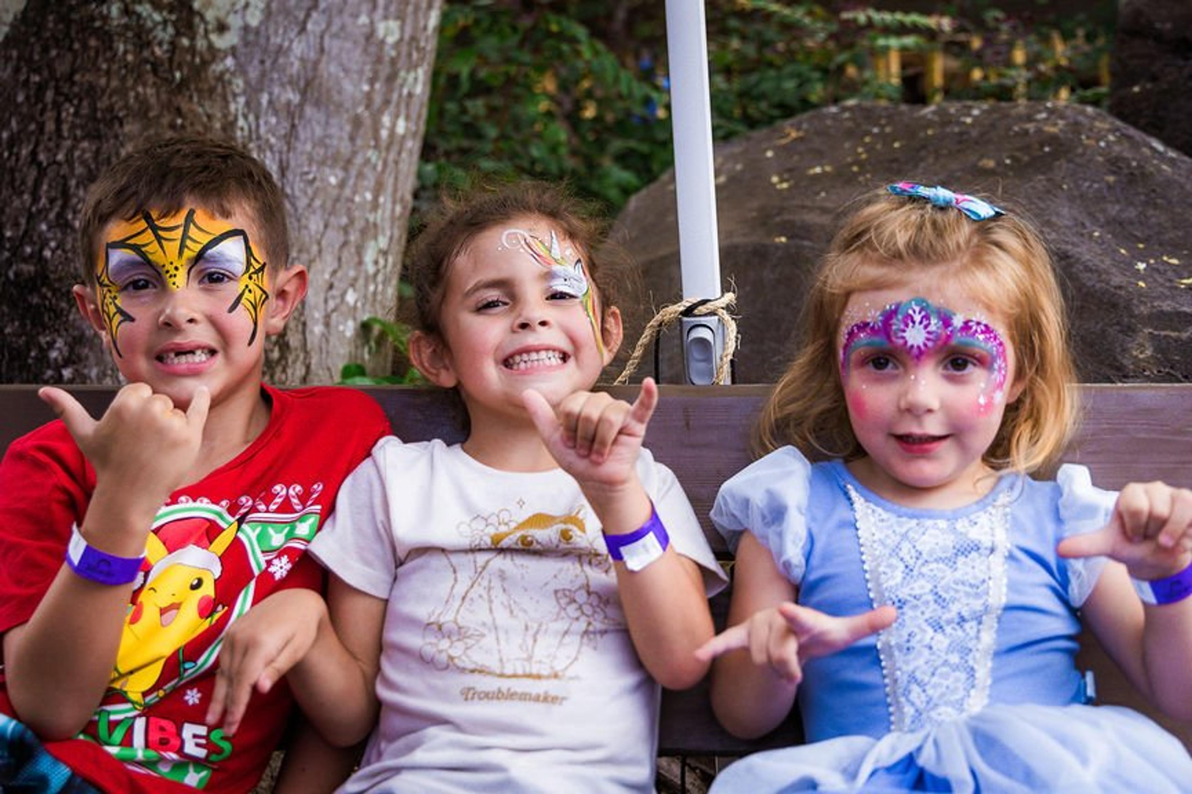 Keiki showing off their face paint