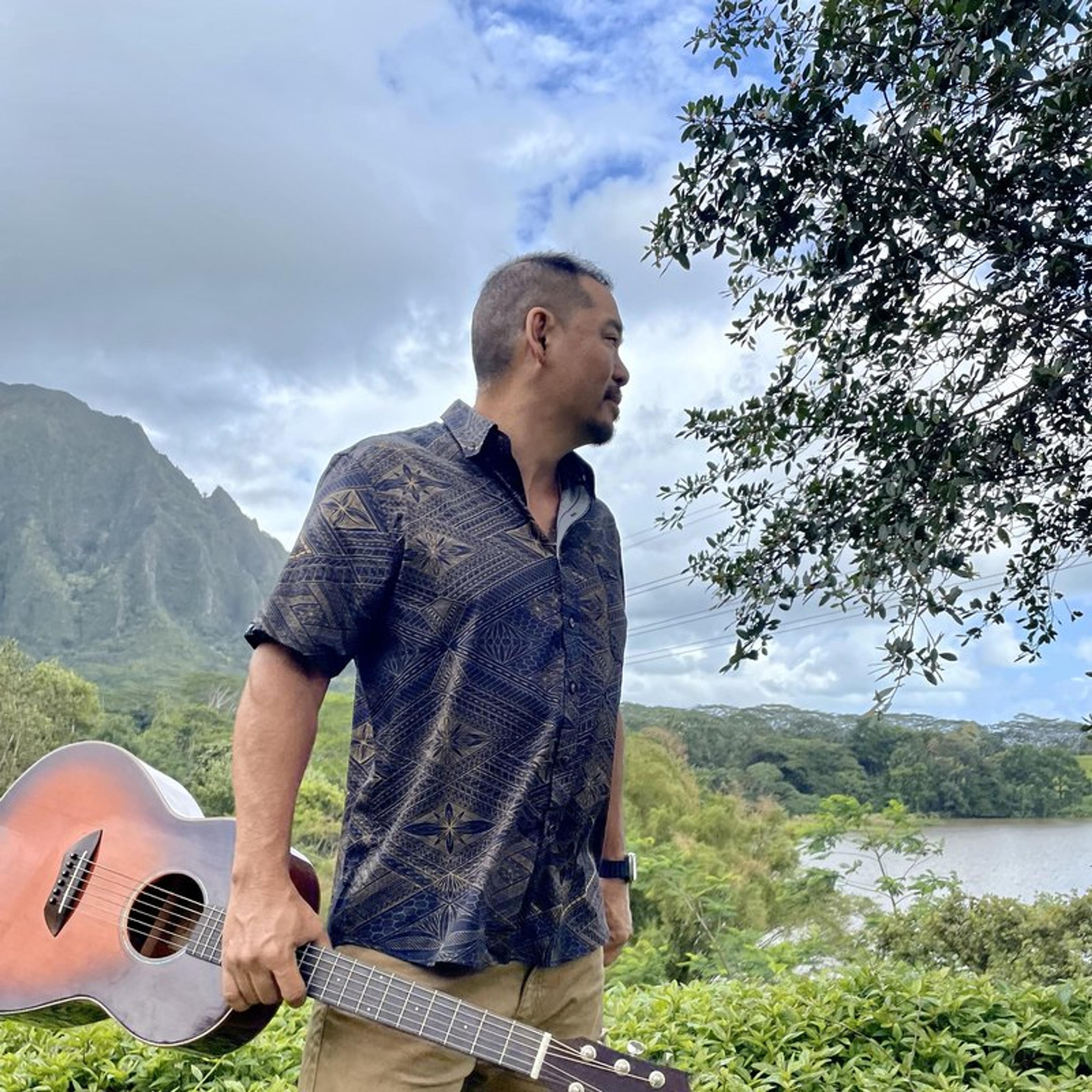 Brandon Onishi with his guitar