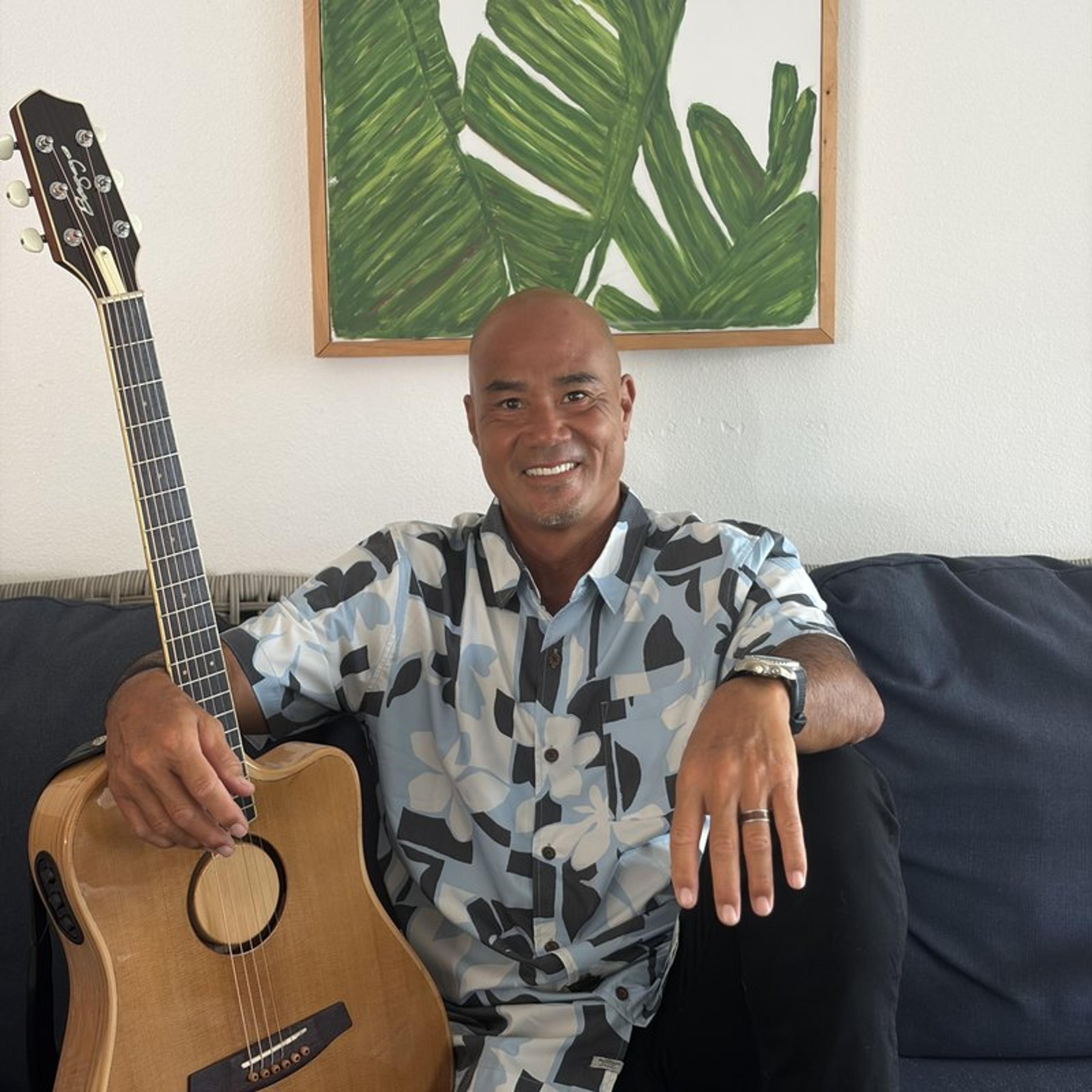 Denny Ono with his guitar