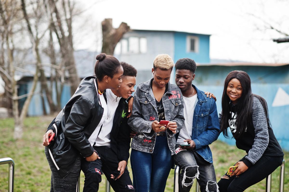 Illustration for “young-millennials-african-friends-with-mobile-phones-happy-black-people-having-fun-together-generation-z-friendship-concept”