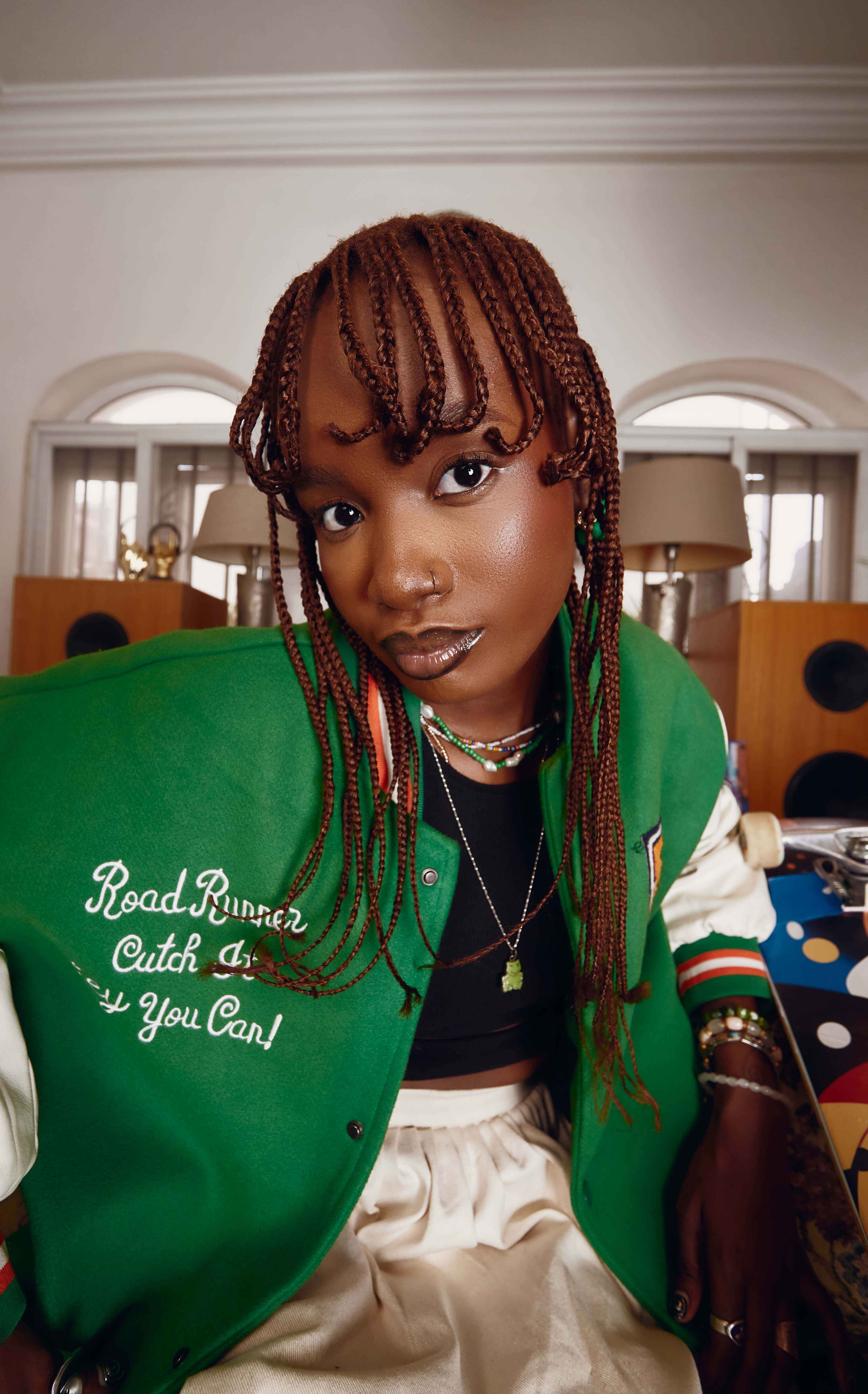 Woman in green varsity