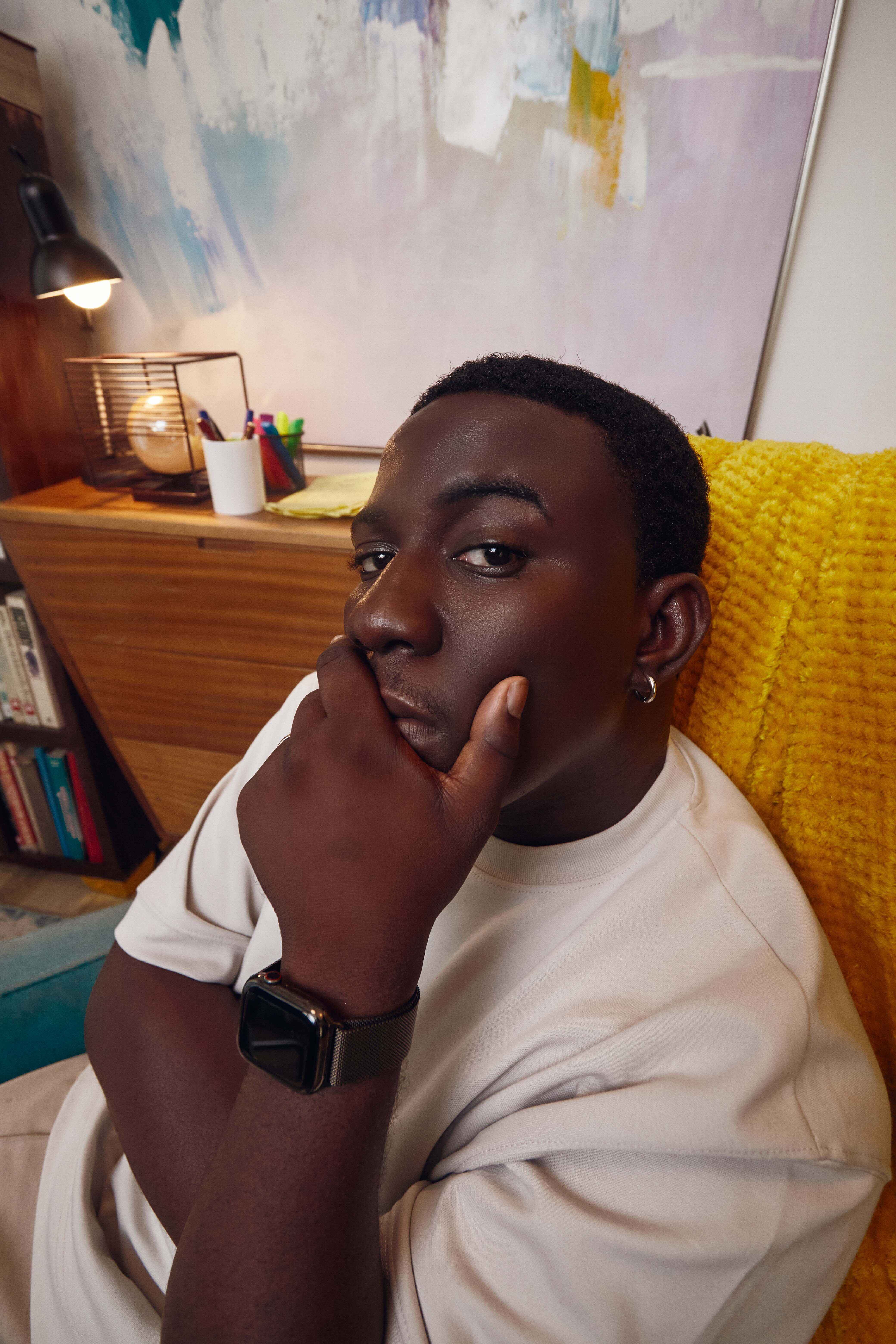 Man in white tee thinking