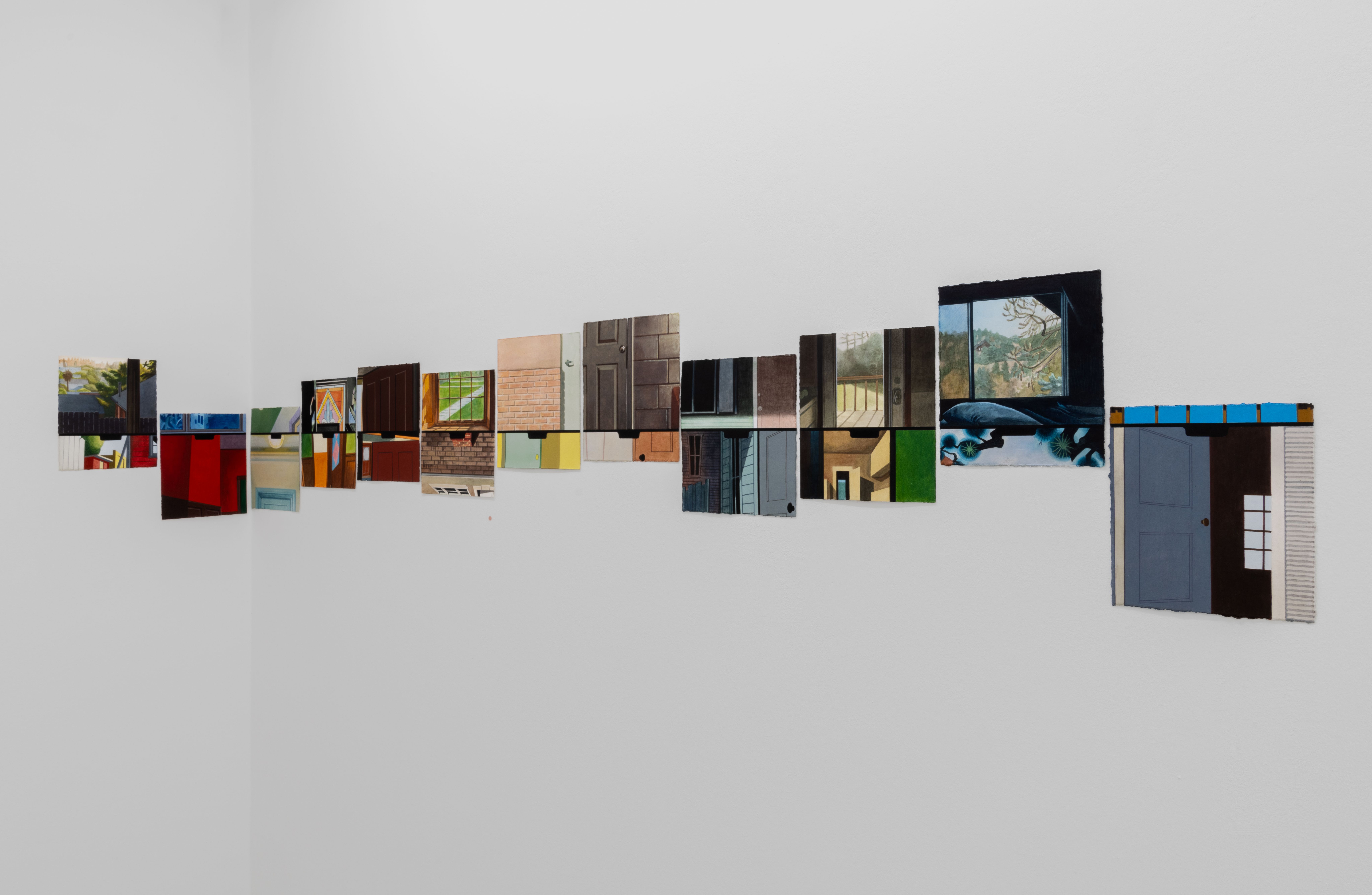 a row of small watercolours hung on a white gallery wall