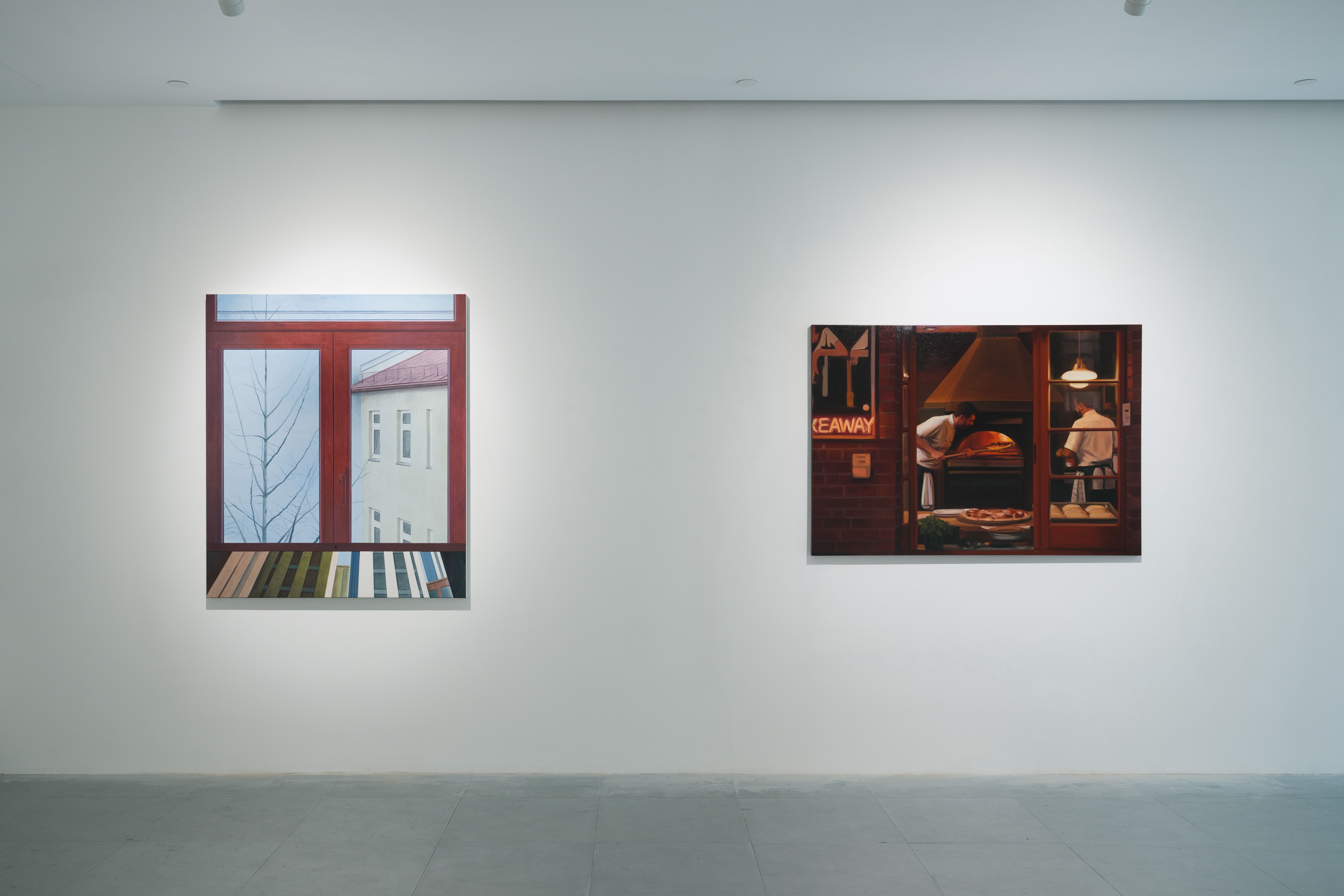 Two paintings in an art gallery