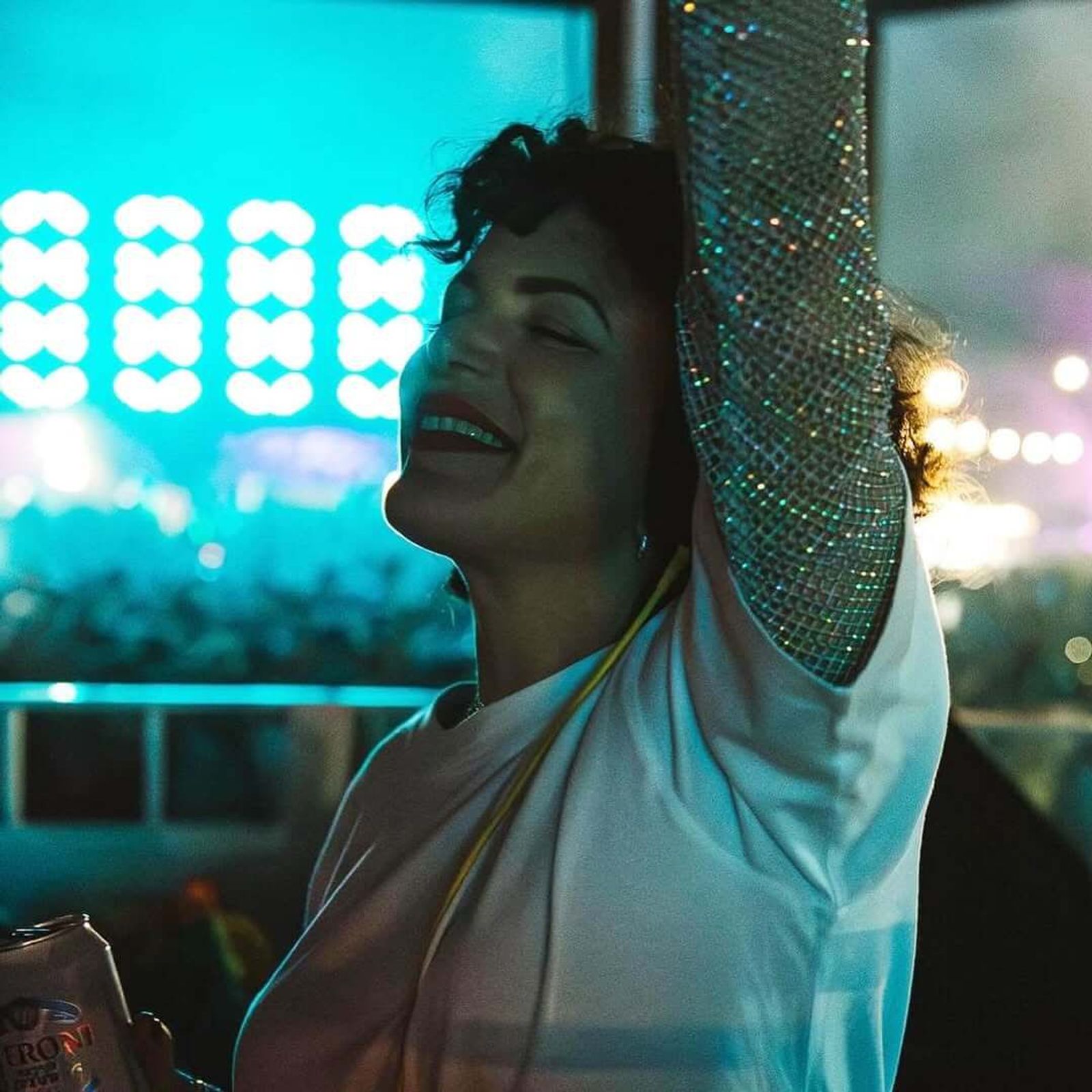 Annie dancing under blue stage lights