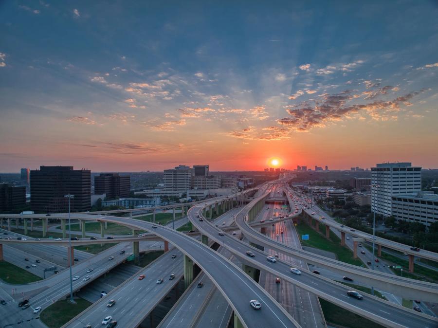A drone view of the High Five Interchange in Dallas at sunrise