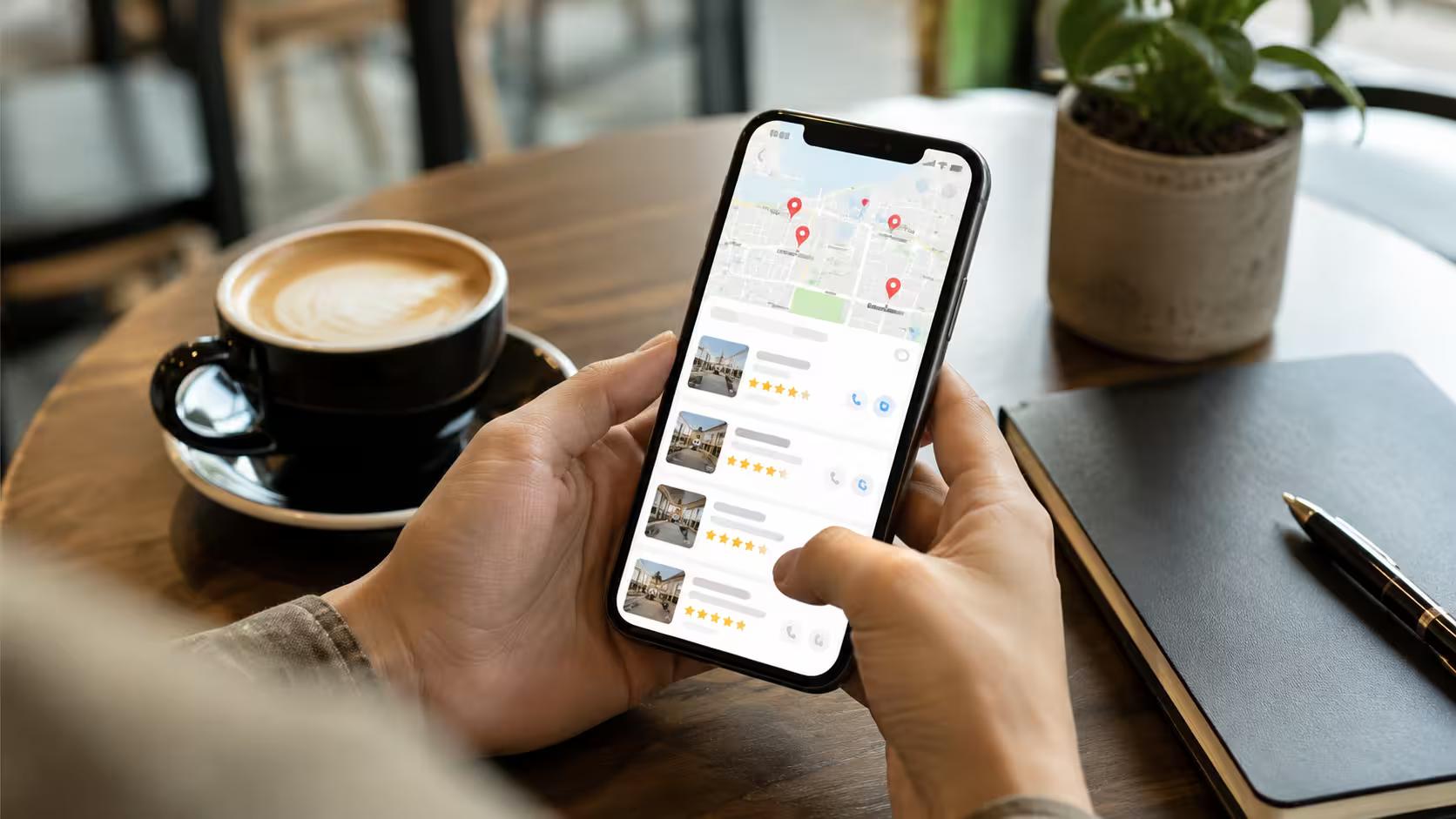 Small business owner reviewing local search results for their business on a phone