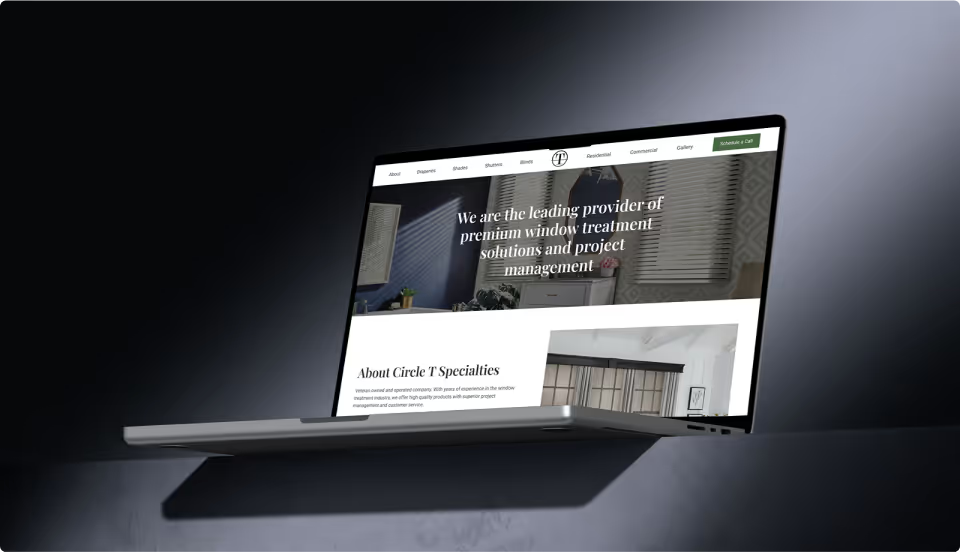 MacBook on dark background displaying Circle T Specialties homepage hero with premium window treatment solutions headline and About Circle T Specialties section