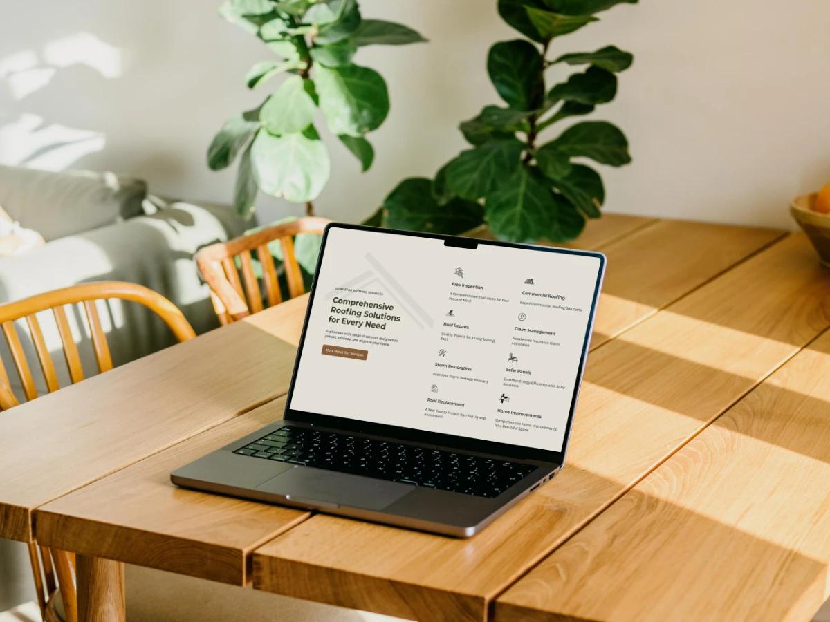 Laptop on a sunlit wooden table showing the Lone Star Roofing services section with free inspection, roof repairs, storm restoration, and solar panels