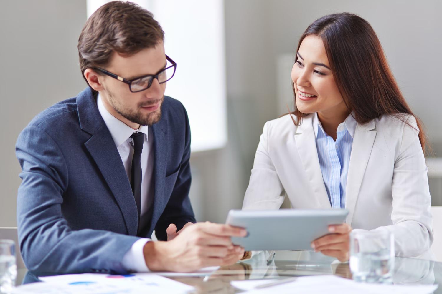 Consultant meeting with a client to discuss their portfolio