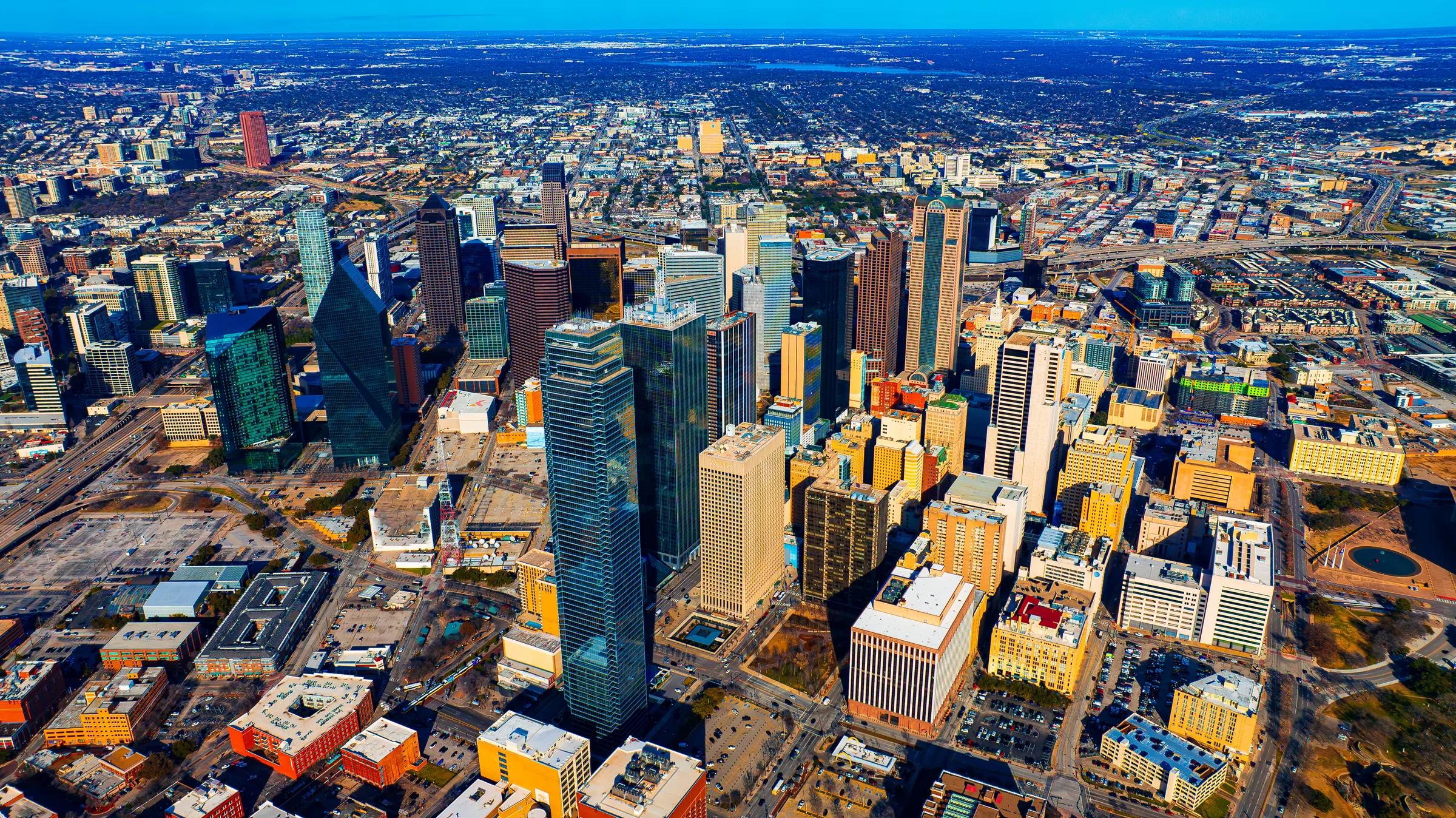 An aerial view of the Uptown Dallas skyscrapers on a clear day