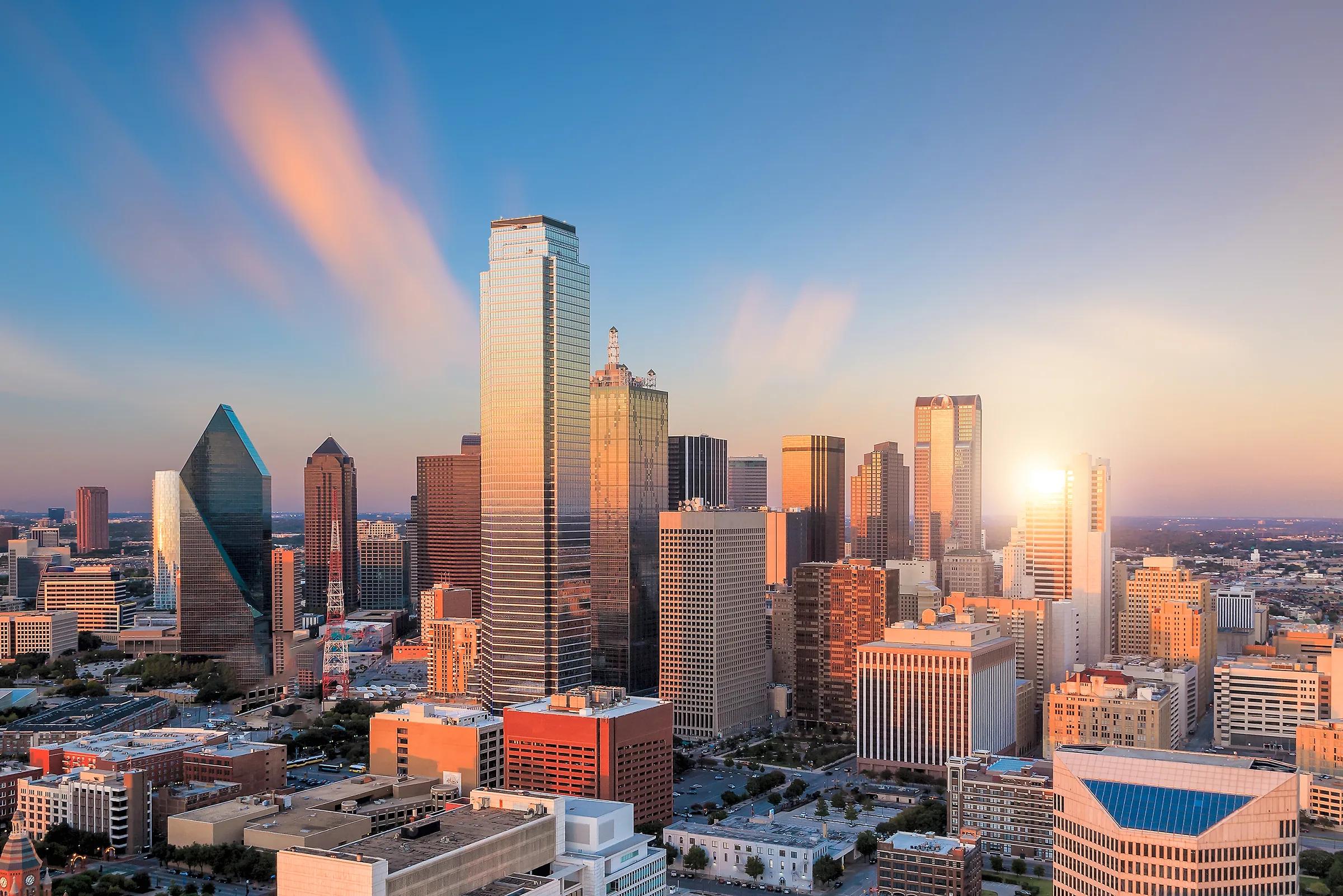 The sun setting behind the Downtown Dallas towers