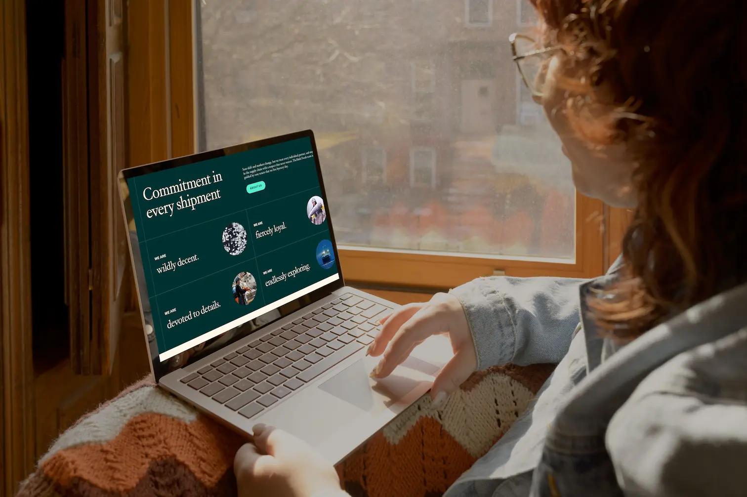 person looking at mark foods commitment section