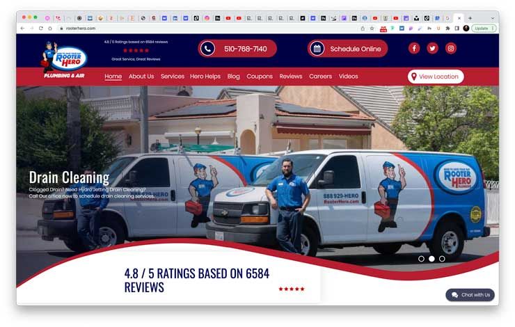 plumbers standing in front of a truck