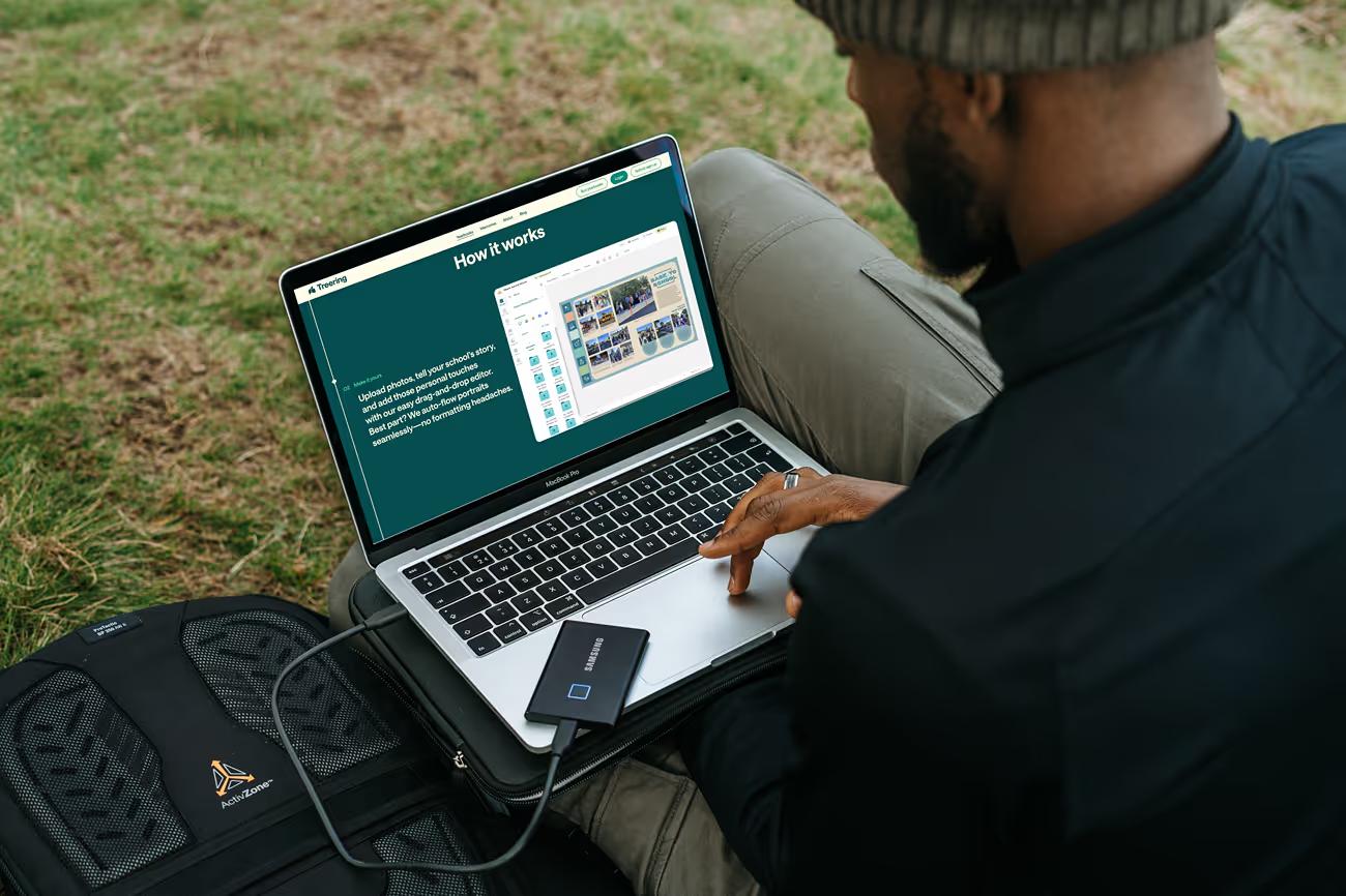 Man outdoors browsing TreeRing on MacBook showing How it works section on teal background with step-by-step yearbook creation process and photo upload interface