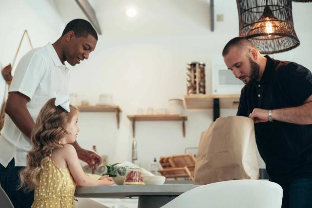 Family members reviewing a simple chore responsibility plan together