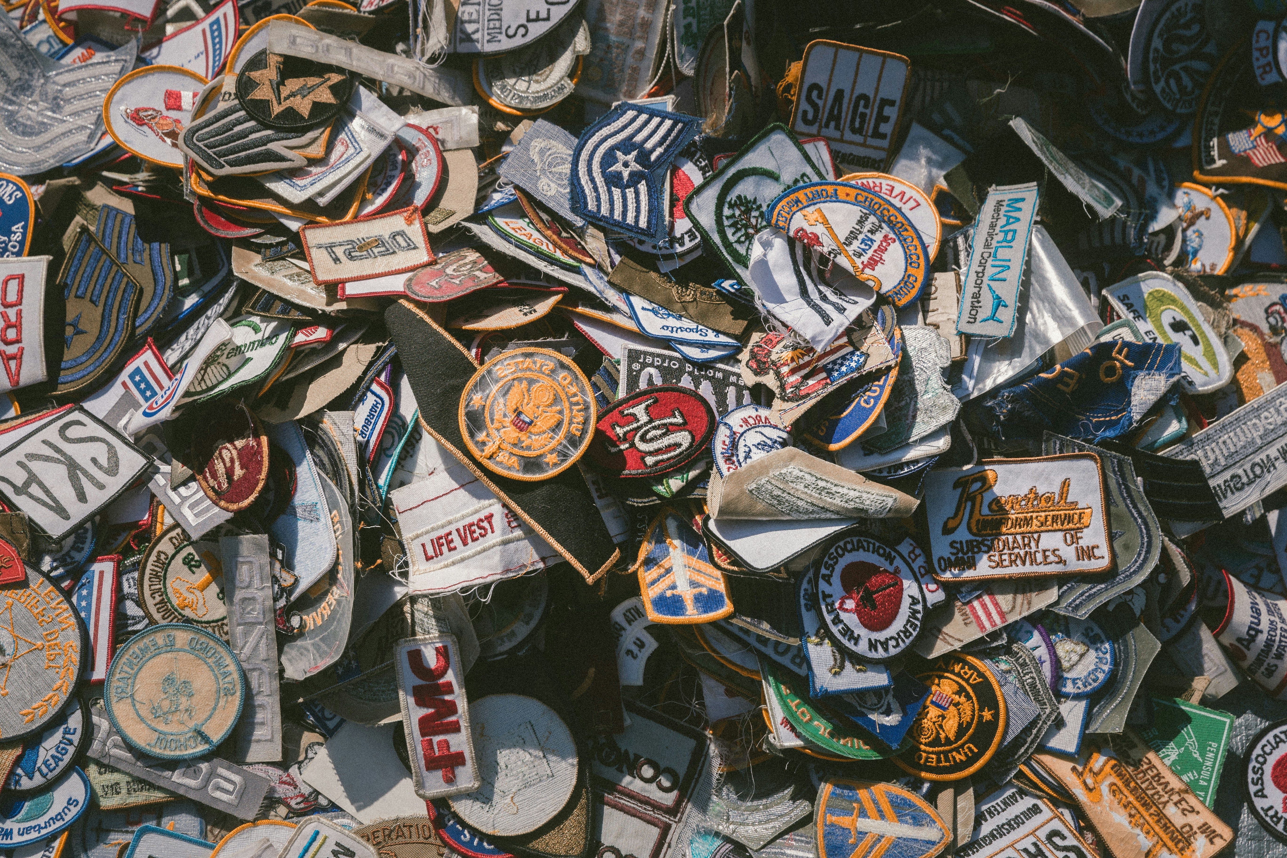 a pile of patches sitting on top of each other on a table .