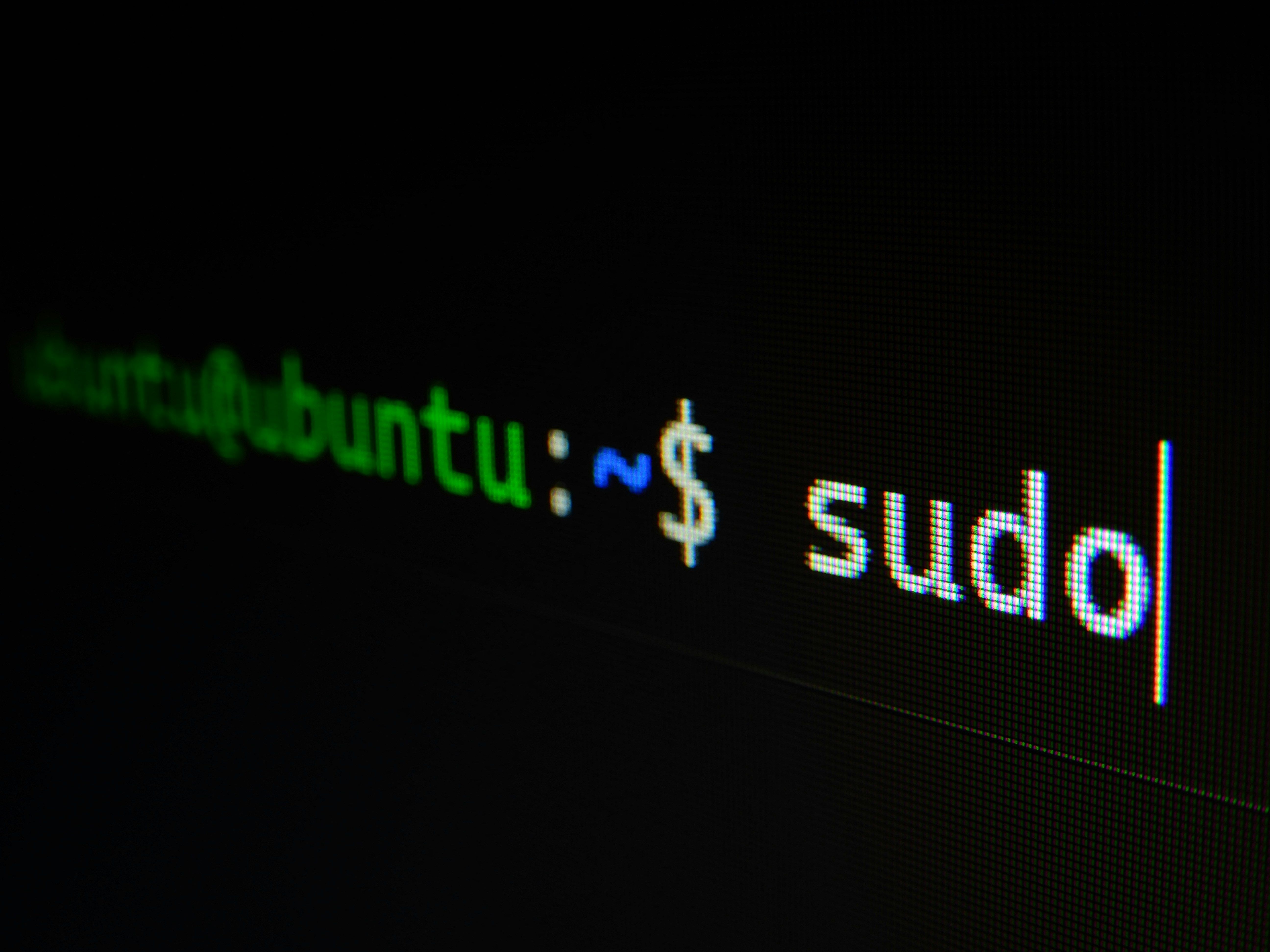 a close up of a computer screen with the word sudo on it .