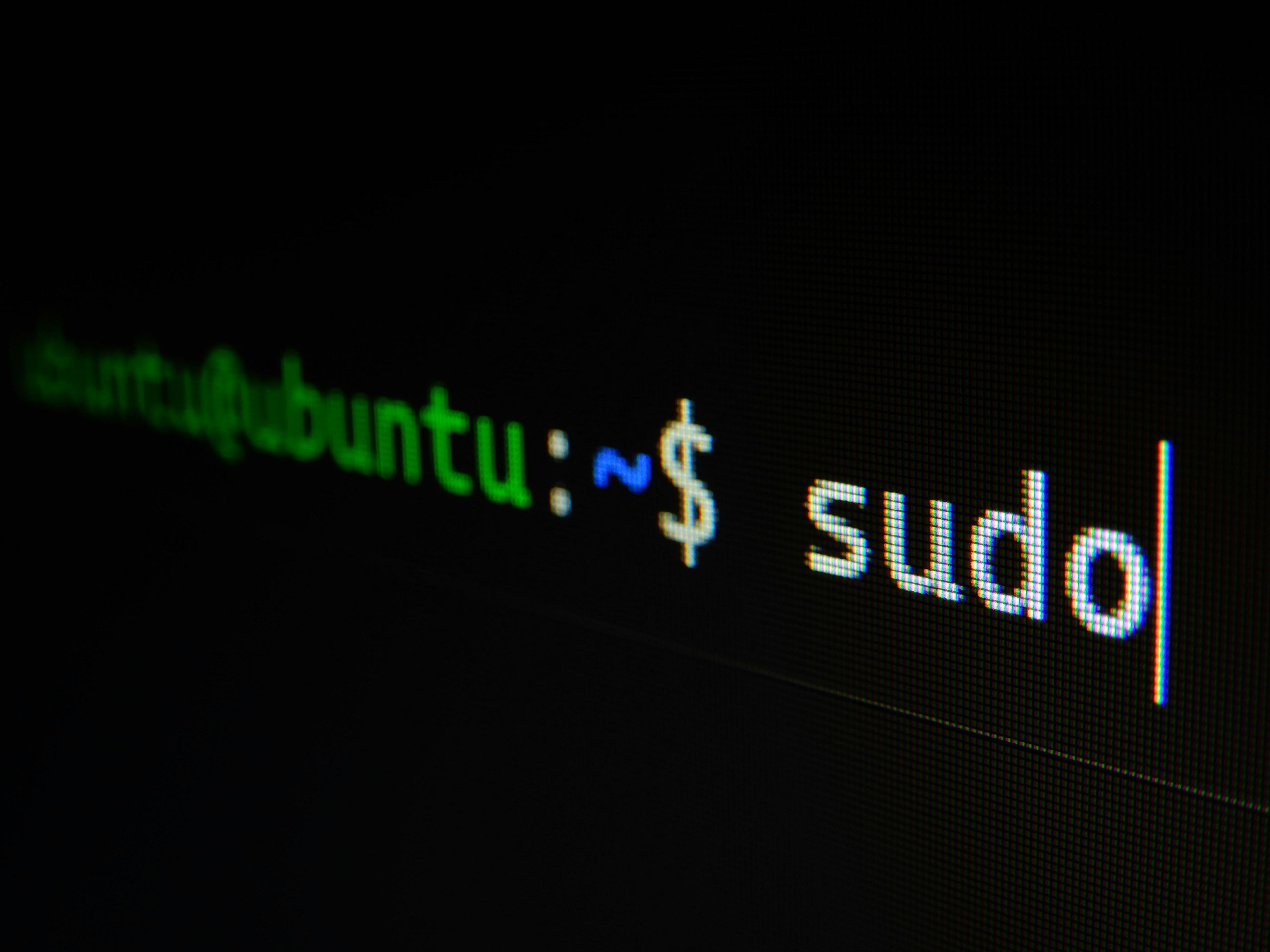 a close up of a computer screen with the word sudo on it .