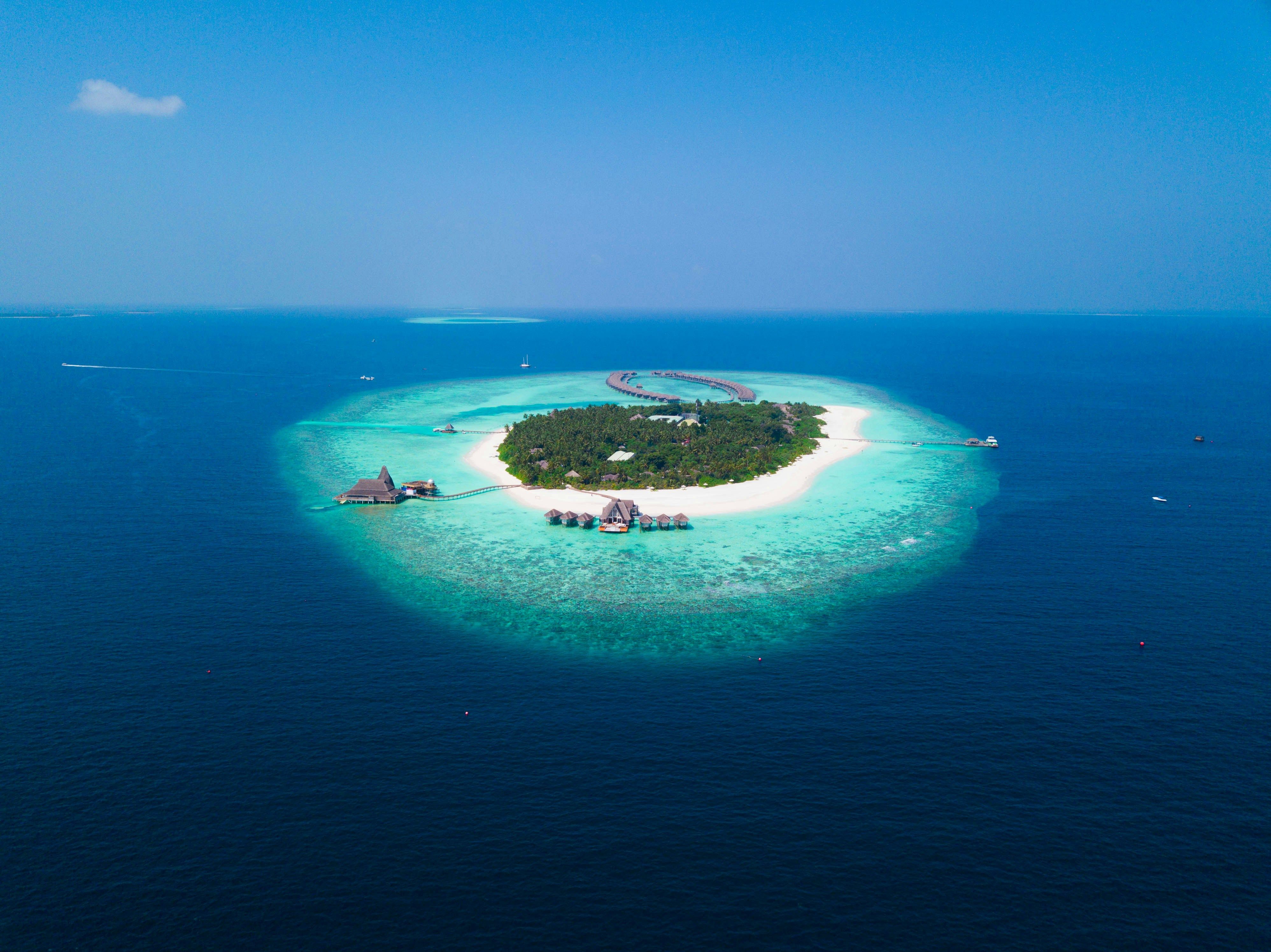 an aerial view of a small island in the middle of the ocean .