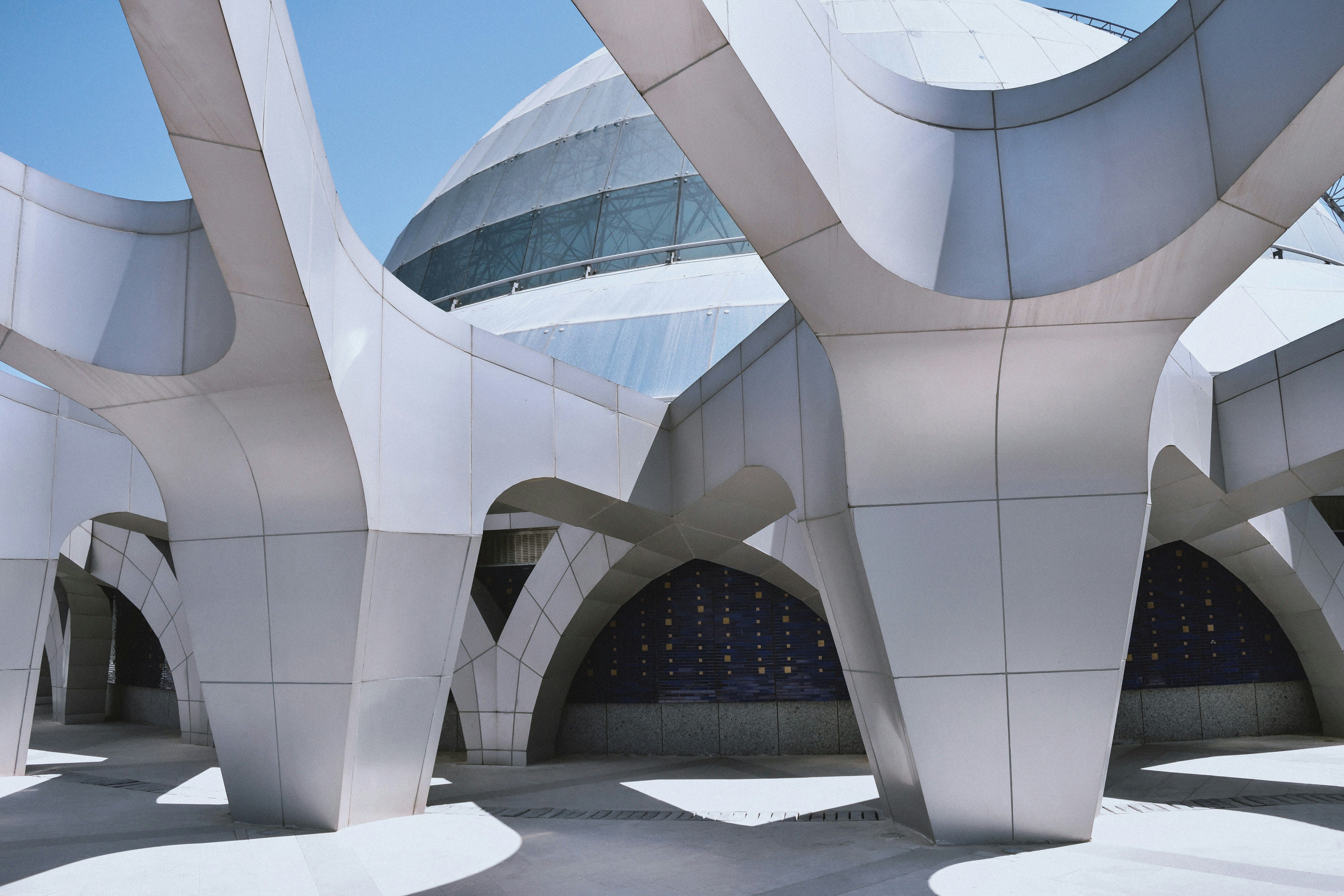 a modern building with a lot of arches and columns .
