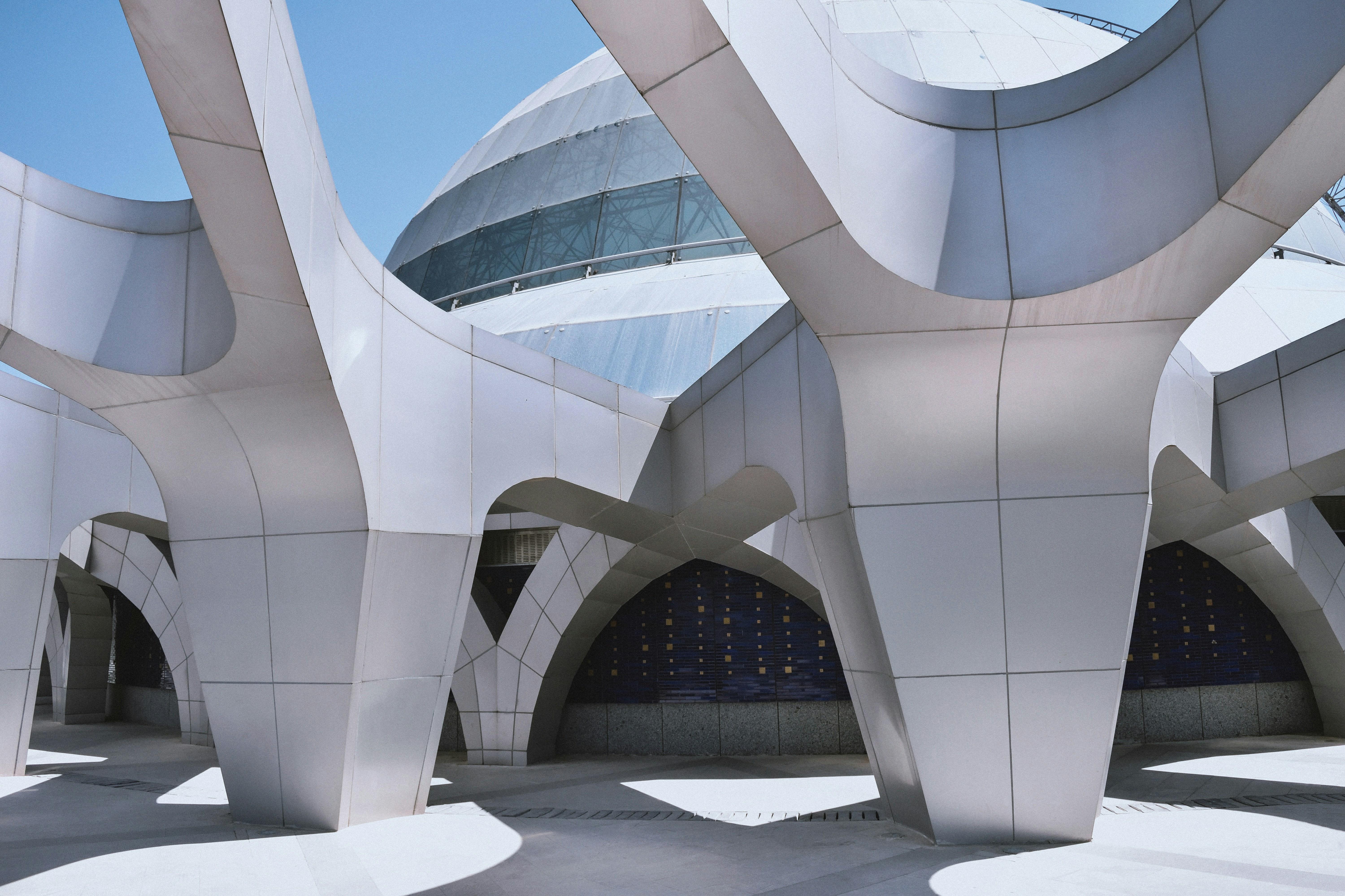 a modern building with a lot of arches and columns .