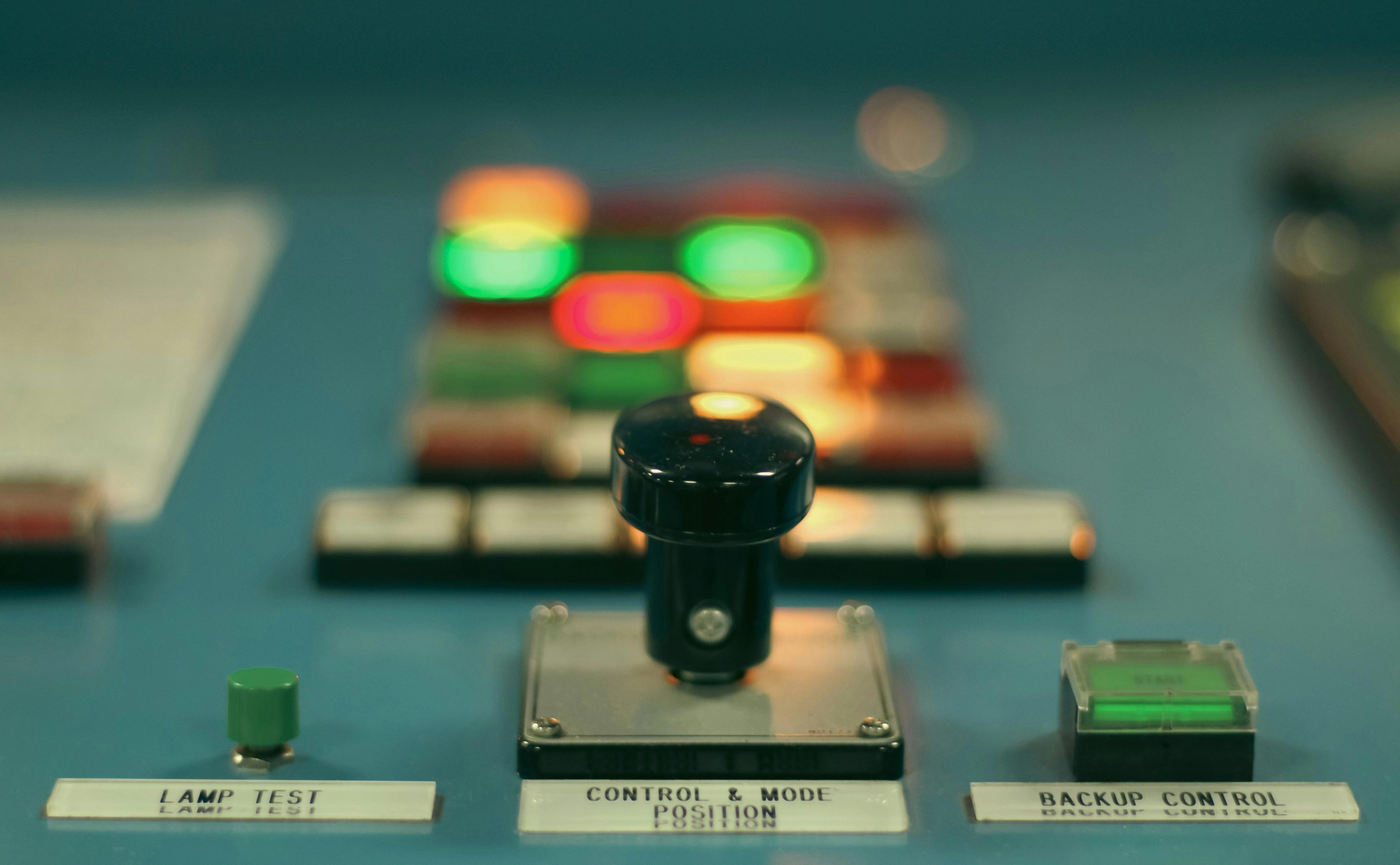 a close up of a control panel with buttons and lights on it .