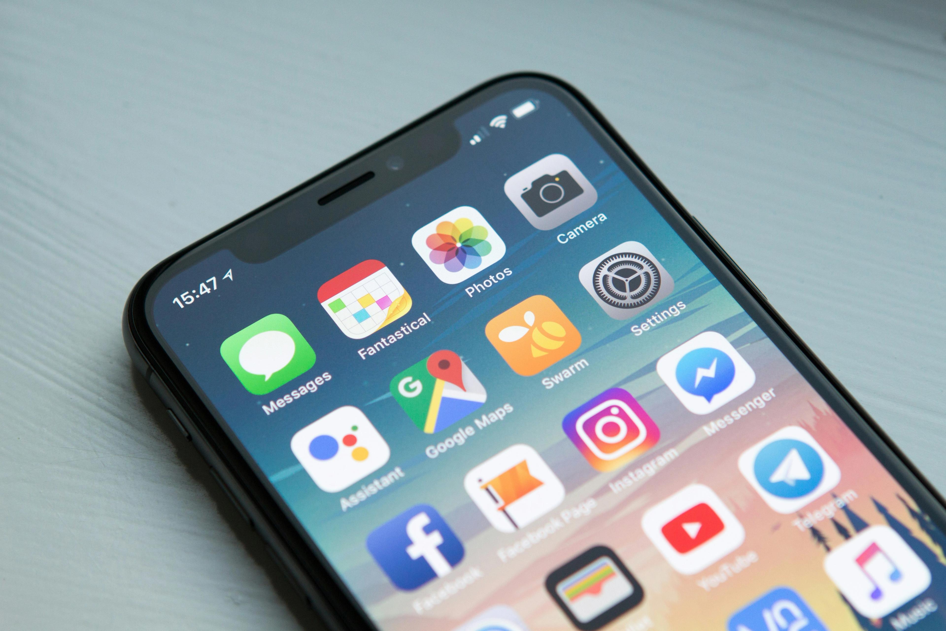 a close up of a cell phone with a bunch of apps on it .