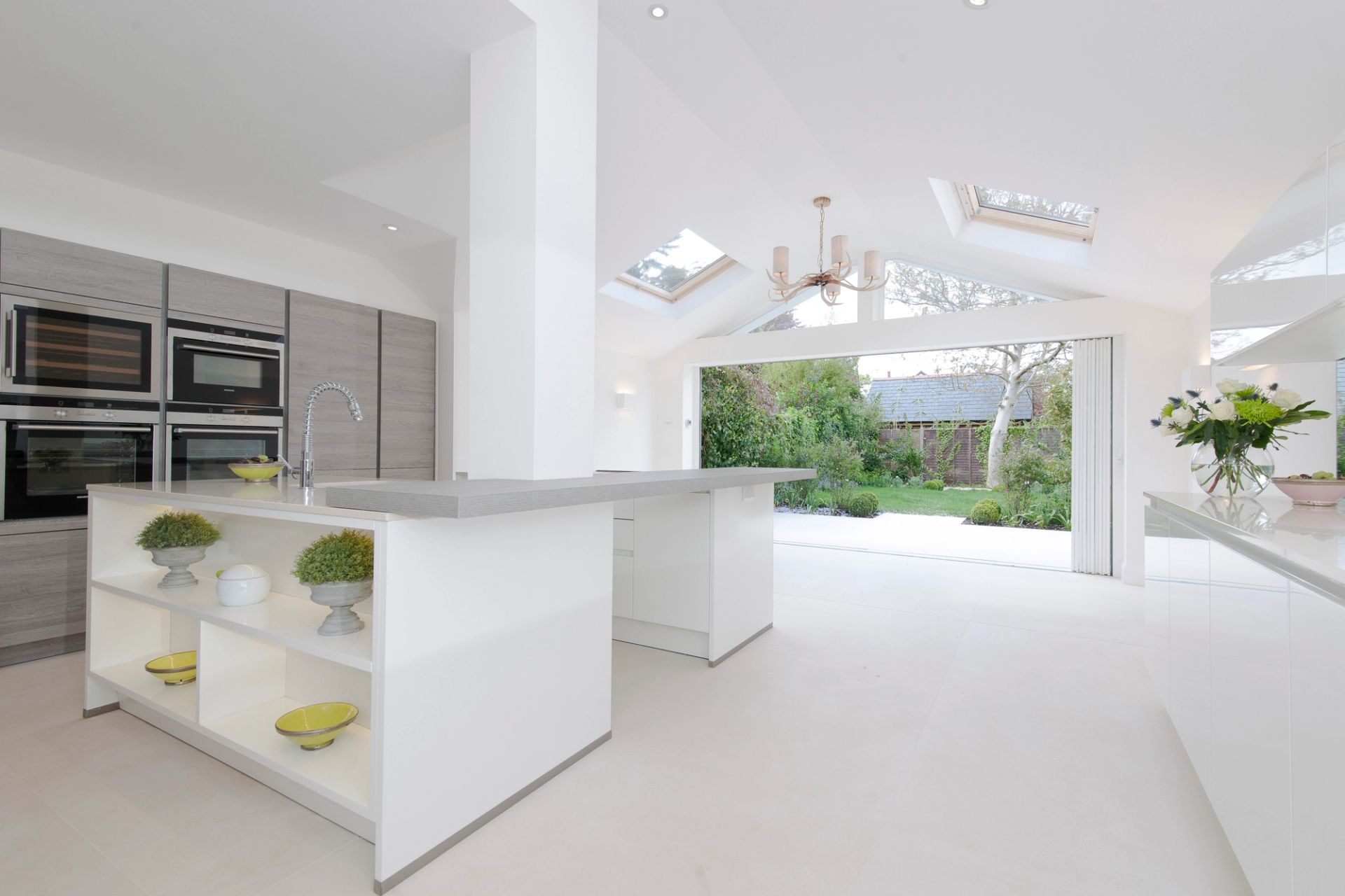 Open modern kitchen with open bi-fold doors