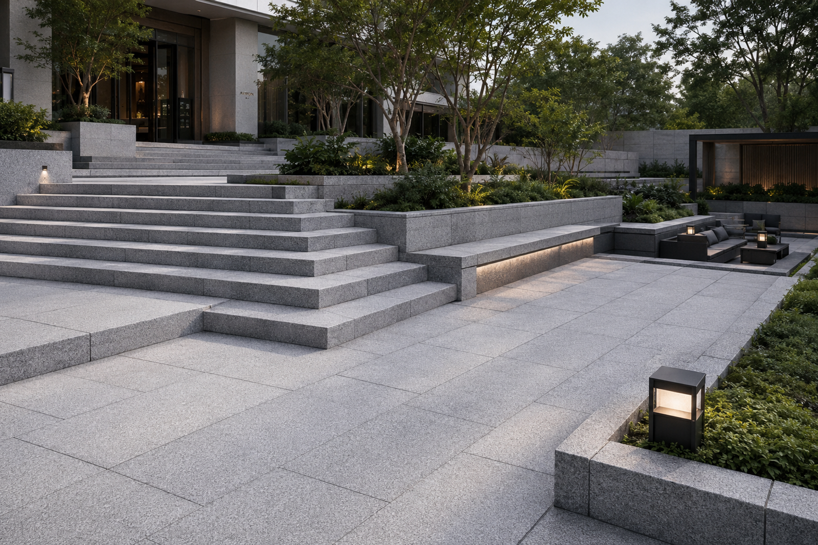Custom natural granite slabs used for modern landscape steps, paving, integrated seating and level changes, creating a continuous and unified outdoor space