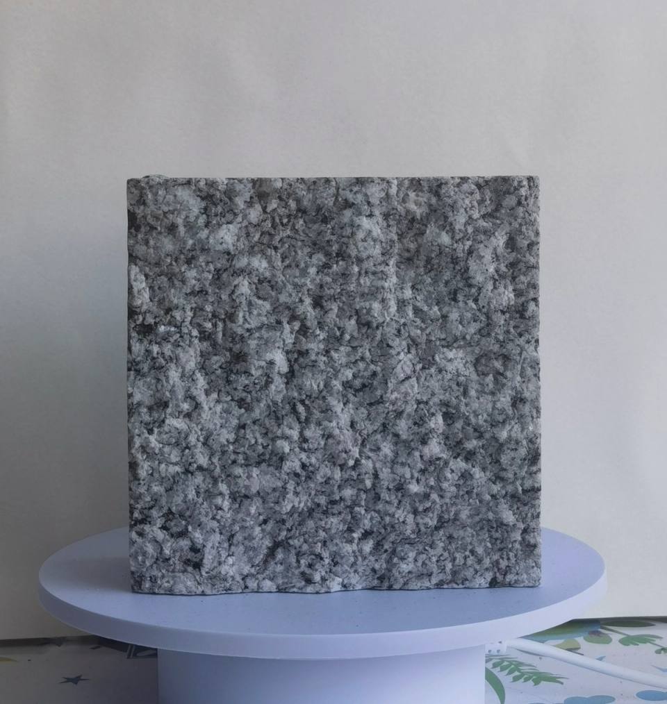 Pearl Grey split finish granite cobblestone product image featuring natural grey mineral grains and a rough split stone texture for outdoor landscape, courtyard, walkway, driveway and project paving.