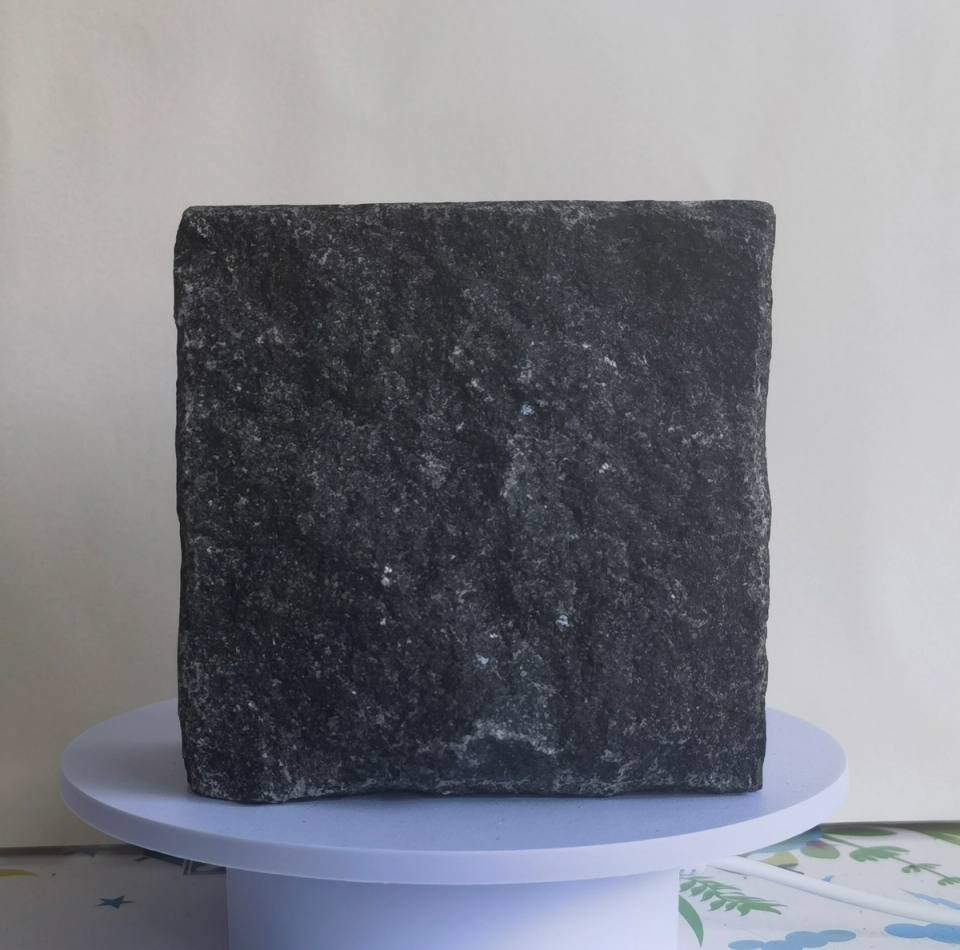 China Black split finish granite cobblestone with a deep black-grey tone and natural rough texture for outdoor streets, plazas and landscape paving.