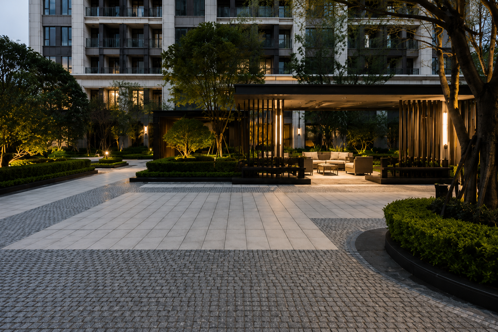 Premium natural granite cobblestones paving residential shared streets, vehicle turning areas and a central landscape courtyard, integrated with large-format granite slabs and landscaped spaces.