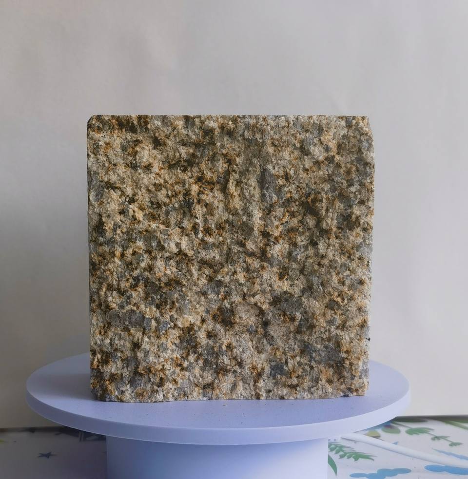 Golden Sesame split finish granite cobblestone with warm golden, beige-grey and dark natural mineral grains and a textured split surface
