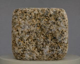 Golden Rust antique finish granite cobblestone with natural golden, rusty brown and grey-white mineral textures, featuring softly aged edges and distinctive natural stone character.