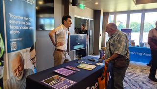 Michael from SeeWay talks with an attendee at a Seniors Expo.