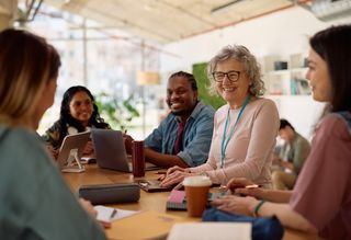 Older woman in a team meeting at work